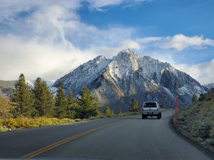 Preview wallpaper car, gray, road, mountains