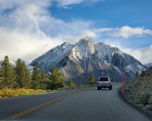 Preview wallpaper car, gray, road, mountains