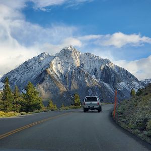 Preview wallpaper car, gray, road, mountains