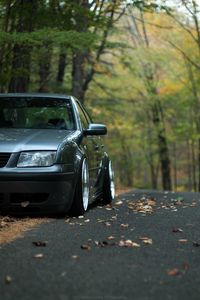 Preview wallpaper car, gray, tuning, road, fallen leaves