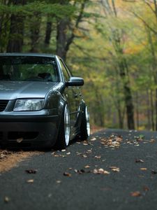 Preview wallpaper car, gray, tuning, road, fallen leaves