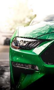 Preview wallpaper car, green, wet, headlight, front view