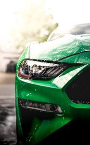 Preview wallpaper car, green, wet, headlight, front view