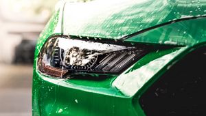 Preview wallpaper car, green, wet, headlight, front view