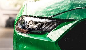 Preview wallpaper car, green, wet, headlight, front view