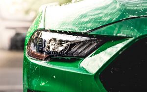 Preview wallpaper car, green, wet, headlight, front view