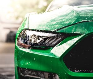 Preview wallpaper car, green, wet, headlight, front view