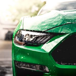 Preview wallpaper car, green, wet, headlight, front view