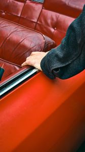 Preview wallpaper car, hand, seat, red