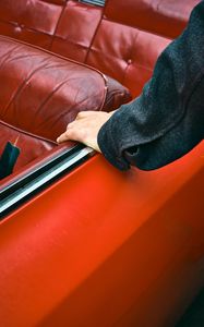 Preview wallpaper car, hand, seat, red