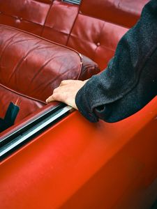 Preview wallpaper car, hand, seat, red