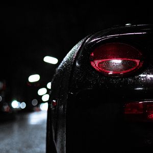 Preview wallpaper car, headlight, drops, moisture, night, dark