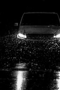 Preview wallpaper car, headlights, bw, rain, drops