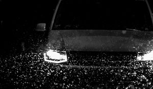 Preview wallpaper car, headlights, bw, rain, drops