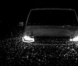 Preview wallpaper car, headlights, bw, rain, drops