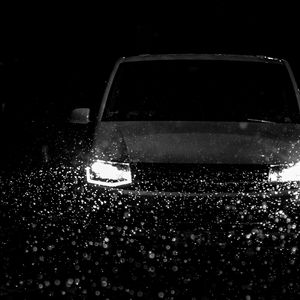 Preview wallpaper car, headlights, bw, rain, drops