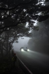 Preview wallpaper car, light, road, fog, gloomy