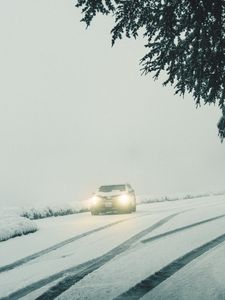 Preview wallpaper car, lights, snow, fog, branches, winter