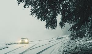 Preview wallpaper car, lights, snow, fog, branches, winter