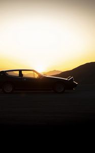 Preview wallpaper car, mountains, silhouettes, sunset, dark