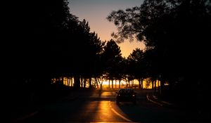 Preview wallpaper car, night, road, trees, shadow