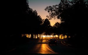 Preview wallpaper car, night, road, trees, shadow