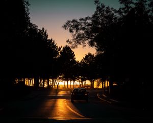 Preview wallpaper car, night, road, trees, shadow