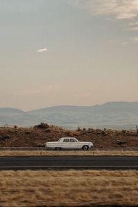 Preview wallpaper car, old, white, road, desert