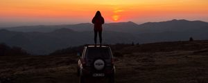 Preview wallpaper car, person, sunset, mountains, nature