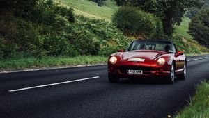 Preview wallpaper car, red, convertible, road, greenery