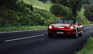 Preview wallpaper car, red, convertible, road, greenery