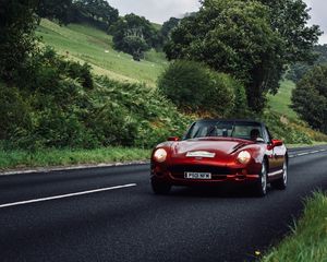 Preview wallpaper car, red, convertible, road, greenery