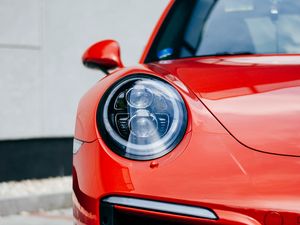 Preview wallpaper car, red, front view, headlight, closeup