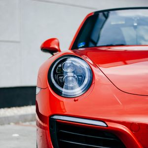 Preview wallpaper car, red, front view, headlight, closeup