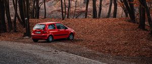 Preview wallpaper car, red, nature, autumn