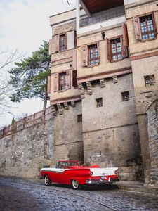 Preview wallpaper car, red, retro, buildings, road