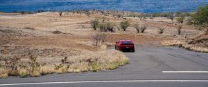 Preview wallpaper car, red, road, desert