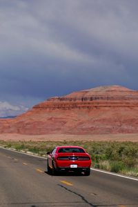 Preview wallpaper car, red, road, mountain