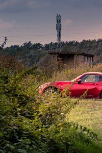 Preview wallpaper car, red, trees, nature