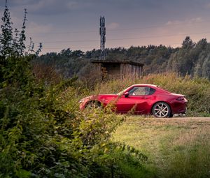 Preview wallpaper car, red, trees, nature