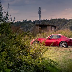 Preview wallpaper car, red, trees, nature