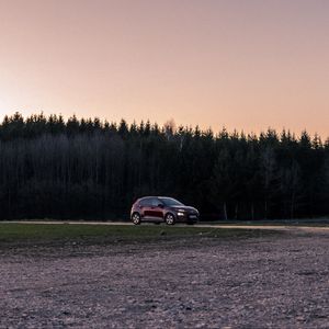 Preview wallpaper car, red, trees, forest