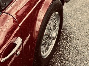 Preview wallpaper car, red, wet, wheel, chrome