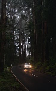 Preview wallpaper car, retro, road, trees, headlights, glow