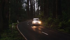 Preview wallpaper car, retro, road, trees, headlights, glow