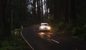 Preview wallpaper car, retro, road, trees, headlights, glow