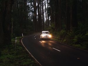 Preview wallpaper car, retro, road, trees, headlights, glow