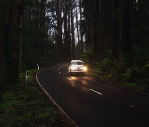 Preview wallpaper car, retro, road, trees, headlights, glow