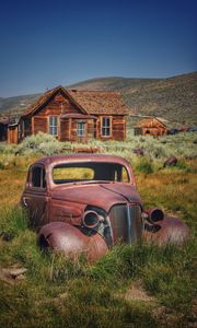 Preview wallpaper car, retro, rust, grass, house, village