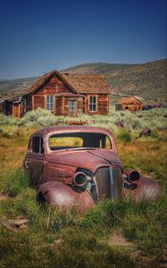 Preview wallpaper car, retro, rust, grass, house, village